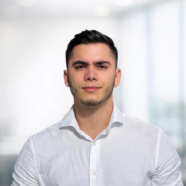 A professional portrait of Juan José Mesa, co-founder of the agency.